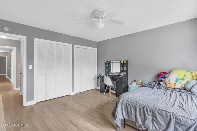 320 Embassy Cir, Wilmington, NC 28412 - bedroom with wood finished floors, two closets, attic access, and a ceiling fan