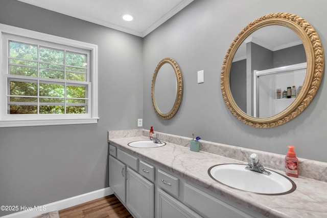 320 Embassy Cir, Wilmington, NC 28412 - full bathroom featuring double vanity, wood finished floors, ornamental molding, and a shower with door
