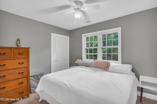 320 Embassy Cir, Wilmington, NC 28412 - bedroom with a closet, light wood finished floors, and a ceiling fan