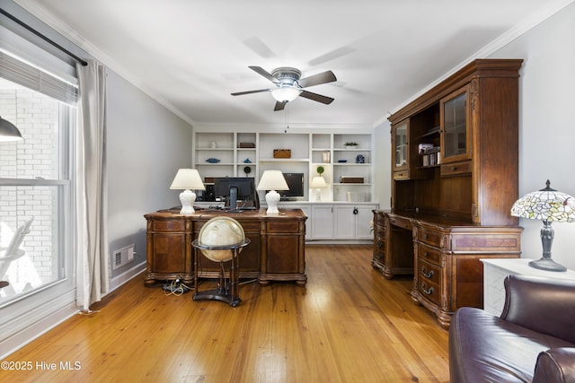 221 Quail Ridge Rd, Wilmington, NC 28409 - office space featuring a ceiling fan, light wood finished floors, baseboards, crown molding, and built in features