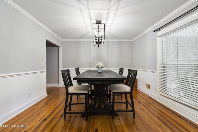 221 Quail Ridge Rd, Wilmington, NC 28409 - dining room featuring crown molding, wood-type flooring, and baseboards