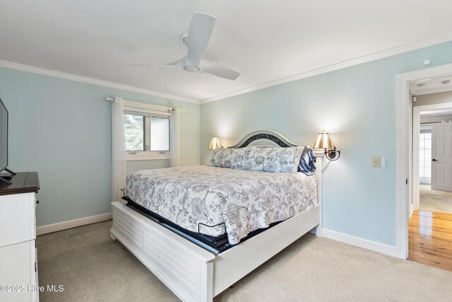 221 Quail Ridge Rd, Wilmington, NC 28409 - bedroom featuring ornamental molding, baseboards, light carpet, and a ceiling fan