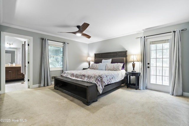 221 Quail Ridge Rd, Wilmington, NC 28409 - bedroom with light carpet, ornamental molding, multiple windows, baseboards, and ensuite bathroom