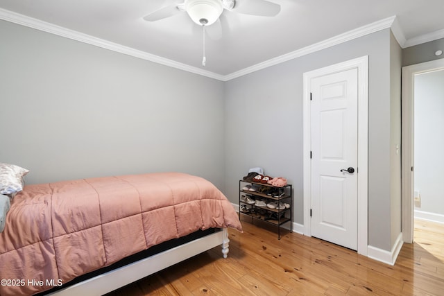 221 Quail Ridge Rd, Wilmington, NC 28409 - bedroom with light wood-style floors, crown molding, baseboards, and ceiling fan