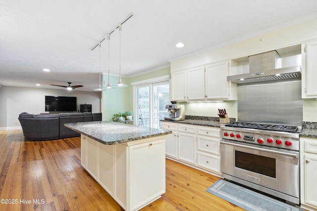 221 Quail Ridge Rd, Wilmington, NC 28409 - kitchen featuring luxury range, wall chimney exhaust hood, track lighting, a center island, and a ceiling fan