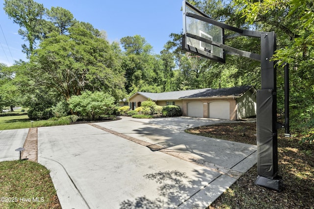 221 Quail Ridge Rd, Wilmington, NC 28409 - view of front of home with concrete driveway and an attached garage