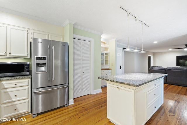 221 Quail Ridge Rd, Wilmington, NC 28409 - kitchen with stainless steel appliances, crown molding, light stone countertops, light wood-style floors, and open floor plan
