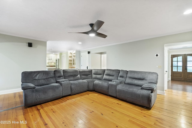 221 Quail Ridge Rd, Wilmington, NC 28409 - living area featuring ornamental molding, light wood-style flooring, a ceiling fan, and baseboards