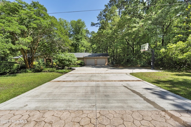 221 Quail Ridge Rd, Wilmington, NC 28409 - obstructed view of property with a front lawn, concrete driveway, and an attached garage