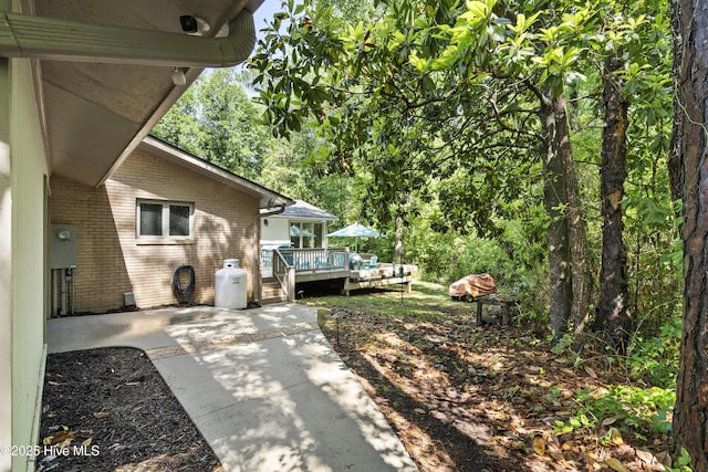 221 Quail Ridge Rd, Wilmington, NC 28409 - view of yard with a deck and a patio area