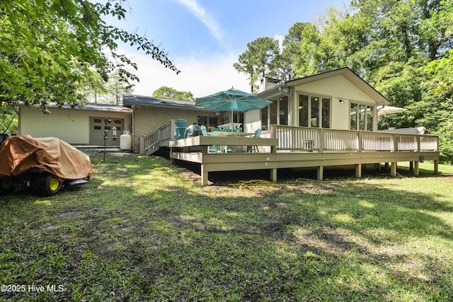 221 Quail Ridge Rd, Wilmington, NC 28409 - rear view of property featuring a deck, a lawn, and french doors