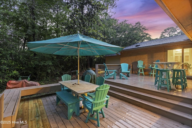 221 Quail Ridge Rd, Wilmington, NC 28409 - deck at dusk featuring outdoor dining area