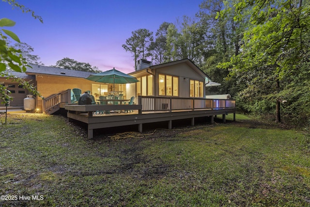 221 Quail Ridge Rd, Wilmington, NC 28409 - back of property featuring a deck and a lawn