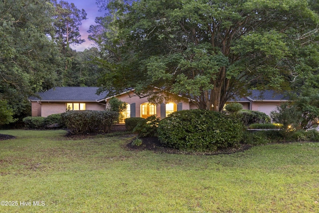 221 Quail Ridge Rd, Wilmington, NC 28409 - view of front of home featuring a front yard and stucco siding