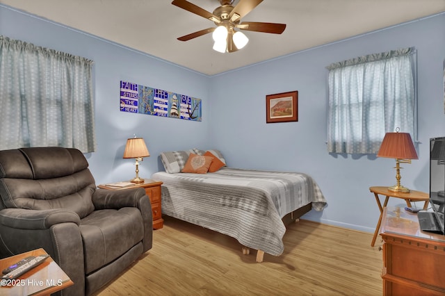 5325 Lord Tennyson Rd, Wilmington, NC 28405 - bedroom with wood finished floors, baseboards, and ceiling fan