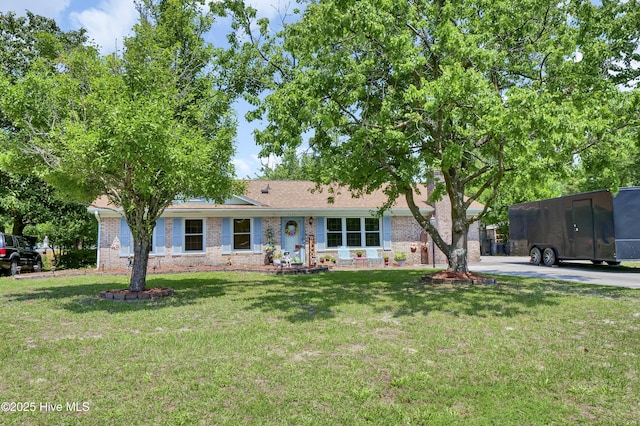 5325 Lord Tennyson Rd, Wilmington, NC 28405 - ranch-style home with brick siding and a front yard