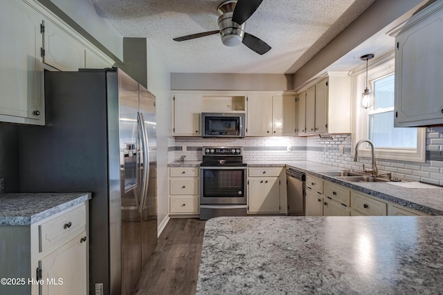 211 Michele Dr, New Bern, NC 28560 - kitchen with appliances with stainless steel finishes, a sink, ceiling fan, dark wood finished floors, and a textured ceiling