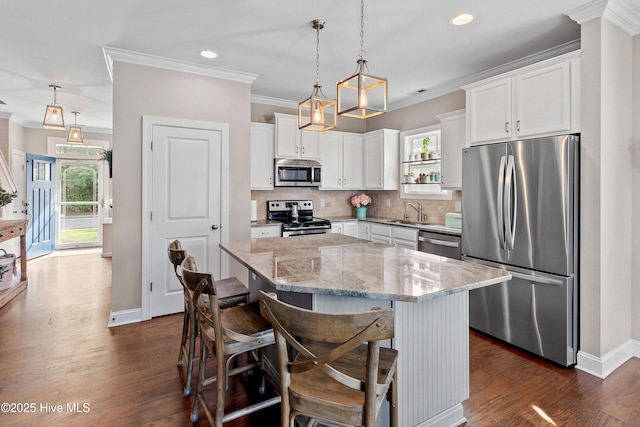 433 Landsdowne Cir, Hampstead, NC 28443 - kitchen with appliances with stainless steel finishes, a sink, plenty of natural light, light stone countertops, and crown molding
