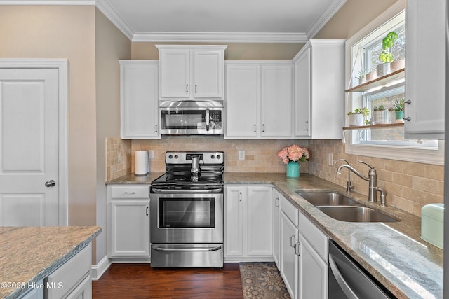 433 Landsdowne Cir, Hampstead, NC 28443 - kitchen with appliances with stainless steel finishes, a sink, white cabinetry, crown molding, and dark wood-style floors