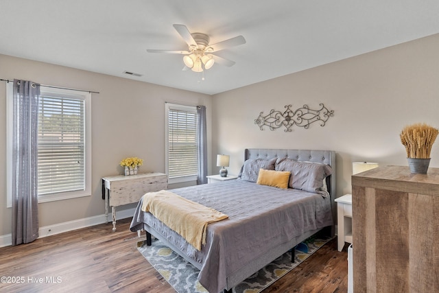 433 Landsdowne Cir, Hampstead, NC 28443 - bedroom with wood finished floors, baseboards, and ceiling fan