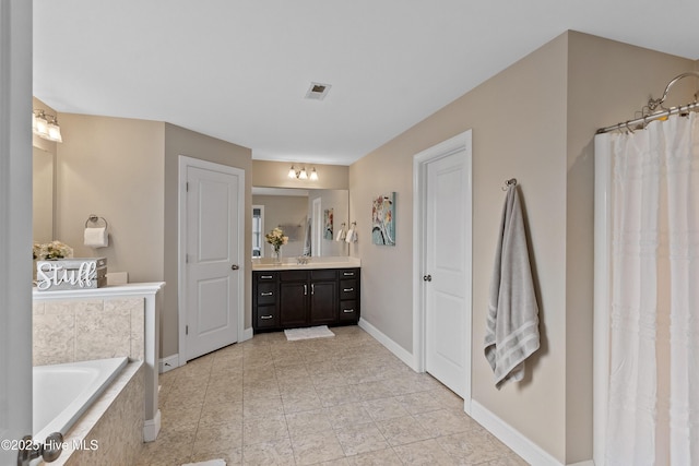 433 Landsdowne Cir, Hampstead, NC 28443 - full bath with vanity, a bath, and baseboards