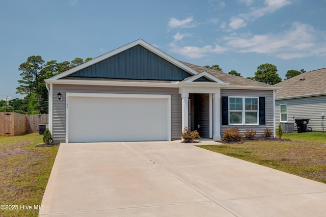 1145 Saint Augustine Dr, Castle Hayne, NC 28429 - view of front of home with driveway, an attached garage, and board and batten siding