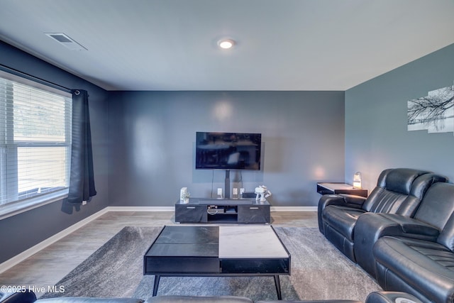 1145 Saint Augustine Dr, Castle Hayne, NC 28429 - living room featuring baseboards and wood finished floors