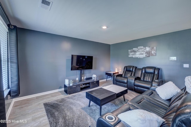 1145 Saint Augustine Dr, Castle Hayne, NC 28429 - living area with wood finished floors, baseboards, and recessed lighting