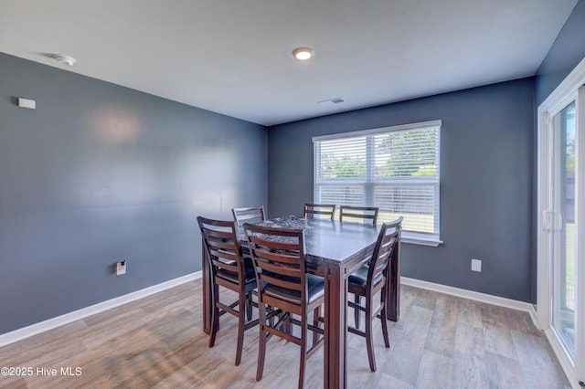 1145 Saint Augustine Dr, Castle Hayne, NC 28429 - dining room with light wood-style floors and baseboards