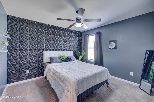 1145 Saint Augustine Dr, Castle Hayne, NC 28429 - carpeted bedroom featuring baseboards, an accent wall, and a ceiling fan
