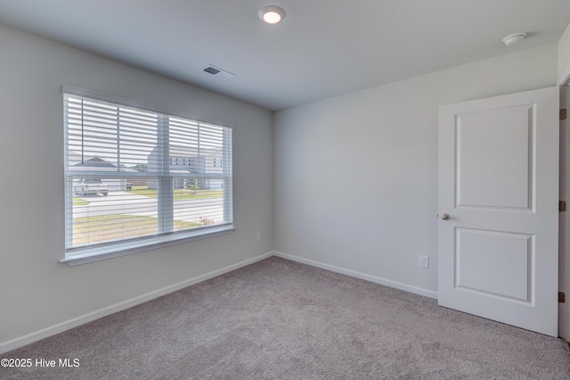 1145 Saint Augustine Dr, Castle Hayne, NC 28429 - unfurnished room with carpet flooring, baseboards, and a smoke detector