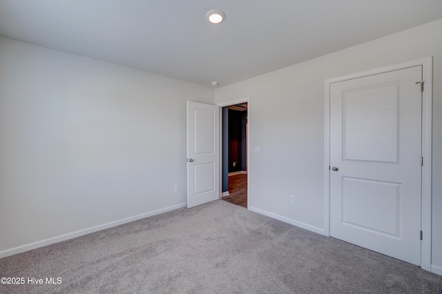 1145 Saint Augustine Dr, Castle Hayne, NC 28429 - unfurnished bedroom featuring carpet and baseboards