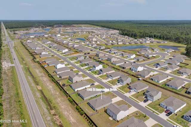 1145 Saint Augustine Dr, Castle Hayne, NC 28429 - aerial overview of property's location with a large body of water, a heavily wooded area, and nearby suburban area