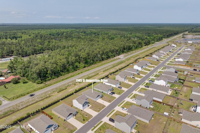 1145 Saint Augustine Dr, Castle Hayne, NC 28429 - aerial view of residential area with a heavily wooded area