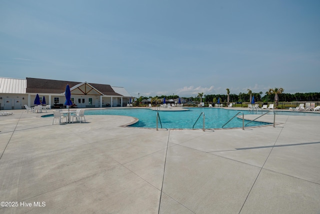 1145 Saint Augustine Dr, Castle Hayne, NC 28429 - community pool featuring a patio