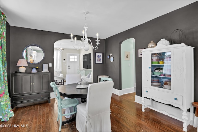 416 S 8th St, Wilmington, NC 28401 - dining room with arched walkways, a chandelier, dark wood-style flooring, and baseboards