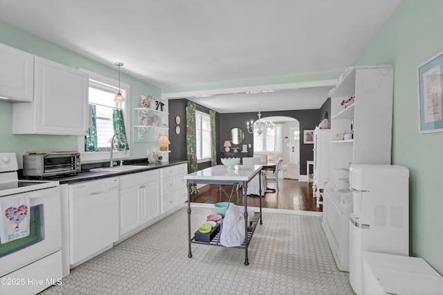 416 S 8th St, Wilmington, NC 28401 - kitchen featuring white appliances, open shelves, a sink, and a chandelier