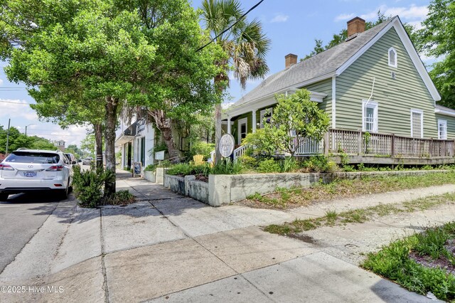 416 S 8th St, Wilmington, NC 28401 - obstructed view of property with a chimney