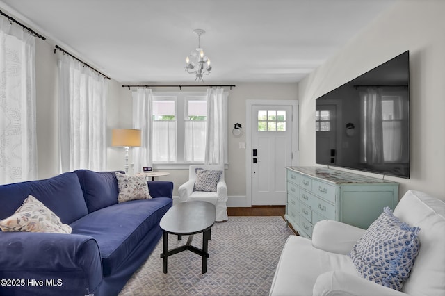 416 S 8th St, Wilmington, NC 28401 - living area with wood finished floors, a chandelier, and baseboards