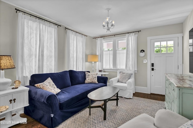 416 S 8th St, Wilmington, NC 28401 - living room with wood finished floors, a chandelier, and baseboards