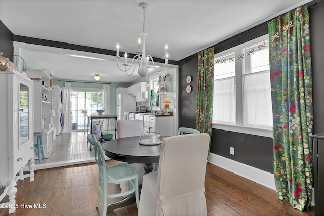 416 S 8th St, Wilmington, NC 28401 - dining room featuring wood finished floors, a chandelier, and baseboards