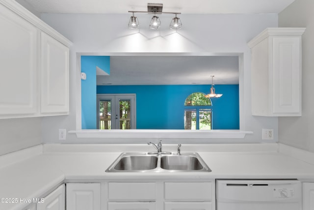 935 Birch Creek Dr, Wilmington, NC 28403 - kitchen featuring dishwasher, plenty of natural light, and white cabinetry
