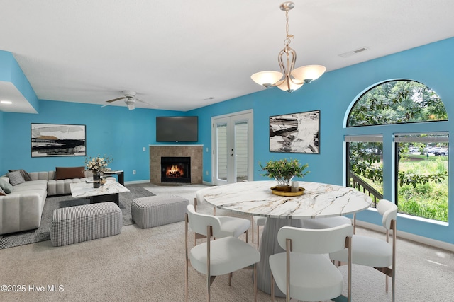 935 Birch Creek Dr, Wilmington, NC 28403 - dining room with healthy amount of natural light, carpet flooring, a fireplace, and a ceiling fan