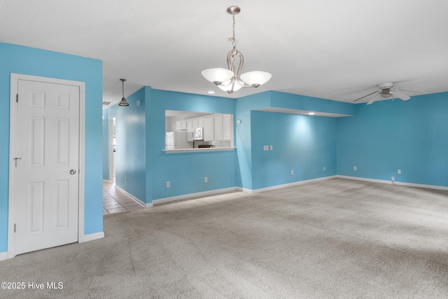 935 Birch Creek Dr, Wilmington, NC 28403 - unfurnished room featuring carpet flooring, a chandelier, and a ceiling fan