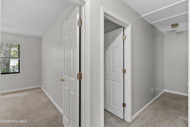 935 Birch Creek Dr, Wilmington, NC 28403 - hallway featuring light colored carpet and a textured ceiling