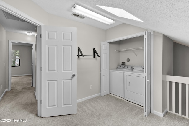 935 Birch Creek Dr, Wilmington, NC 28403 - laundry area featuring washer and clothes dryer, light carpet, and a textured ceiling