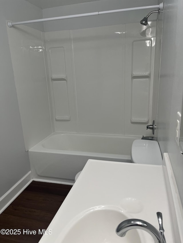 527 Chicora St, Grimesland, NC 27837 - full bathroom featuring baseboards, wood finished floors, and bathtub / shower combination