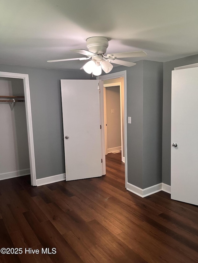 527 Chicora St, Grimesland, NC 27837 - unfurnished bedroom with dark wood-style floors, baseboards, and ceiling fan