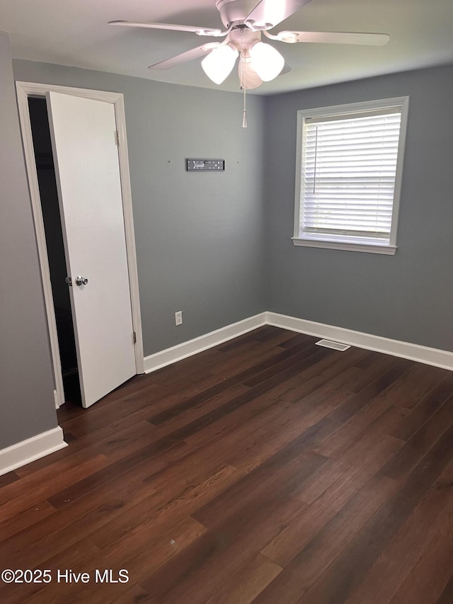 527 Chicora St, Grimesland, NC 27837 - empty room with a ceiling fan, baseboards, and dark wood-style floors