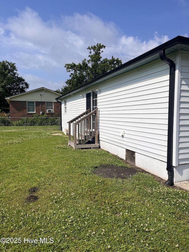 527 Chicora St, Grimesland, NC 27837 - back of house with a yard